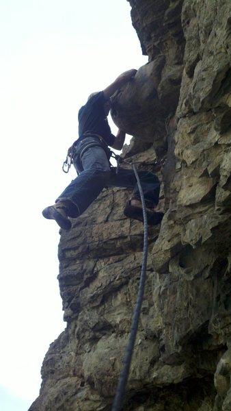 Caleb at the "out of place" boulder sticking out in the middle of the route