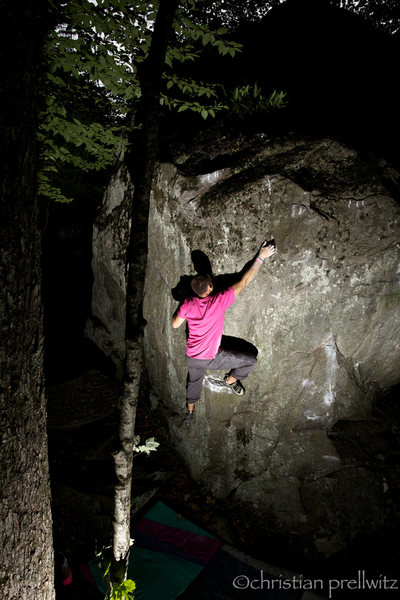 Sticking the crux move of 'Up Into The Green Silence'- Rumney, NH.