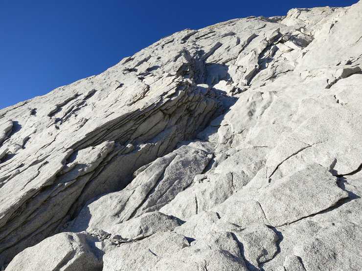 This is a closer shot of the start of the route. The next ledge up is the start of the first pitch. You can clearly see the right facing lieback flakes and cracks here.