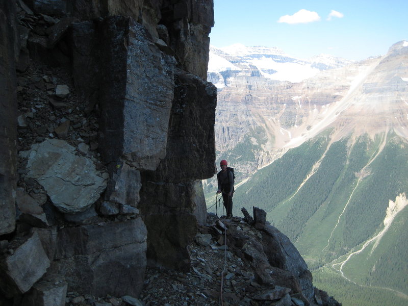 Looking back at Glenn as I began the leftward traverse at about 2/3 height.