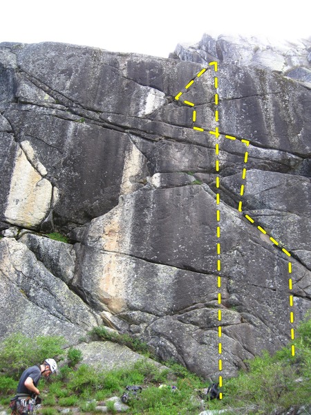 The route is visible here.  Start on face holds below left facing/leaning dihedral and continue almost straight up to horizontals.  head left at horizontals for the finger crack heading to the top.