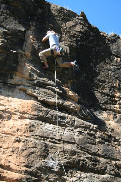 Dean Huwe at the upper crux during FA.