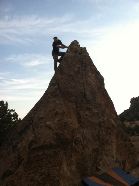 Zach on the downclimb of Triangle Boulder.