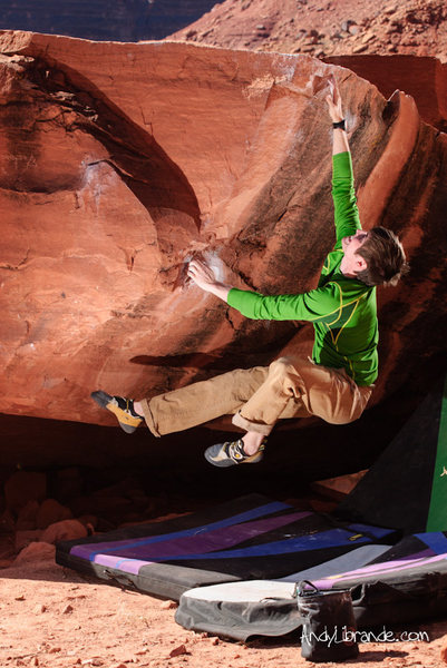 Chris barely missing the top of the reachy "Dyno for Dollars"<br>
<br>
Feb 2012<br>
<br>
http://andylibrande.com/news/2012/05/moab-bouldering-in-february/