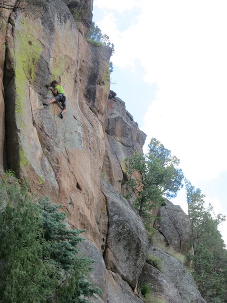 John Crawley moves through superb technical climbing before the crux of Free Radical. In this photo, John is linking Back to Nature with Free Radical.