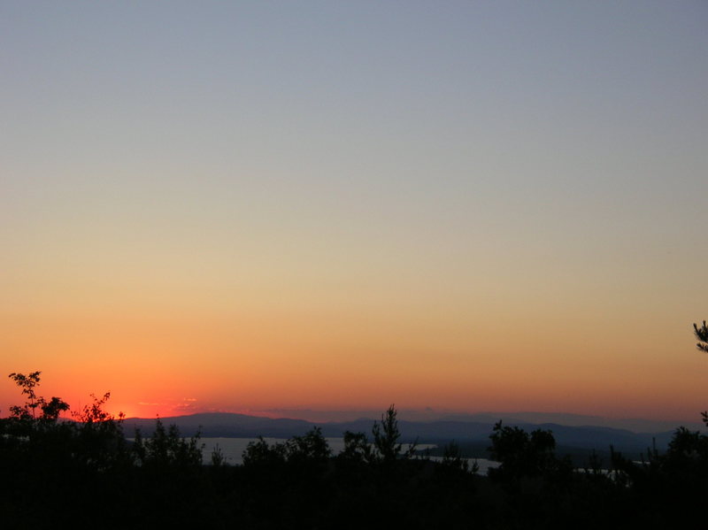 Sunset from the top of Longstack Precipice. Lake Winnepesaukee and Knights Pond in the foreground.