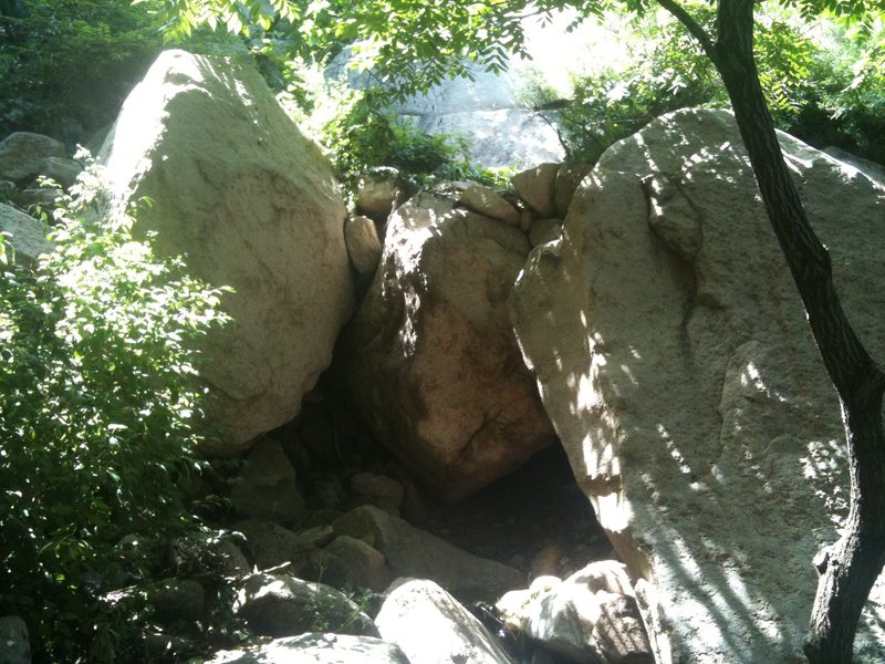 On the rightmost boulder. Left line on the overhanging face.