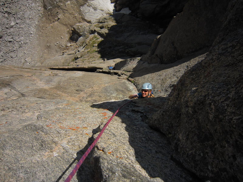 Kat A. emerges from under the roof on P2, ready to battle the crux of that pitch (5.11- again).