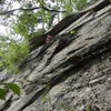 Loran Smith under the roof on his route Coyote Rain