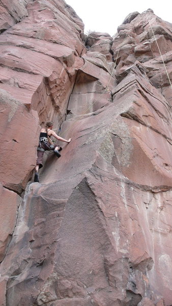 Hanna moving up through the lower dihedral. Note that up high the climb goes left of the rope, I just didn't place any gear up there.