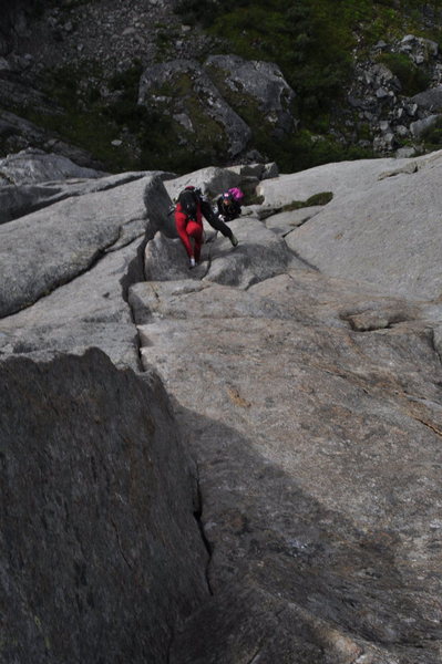Climbing up to one of the crux overlaps on the 3rd pitch.