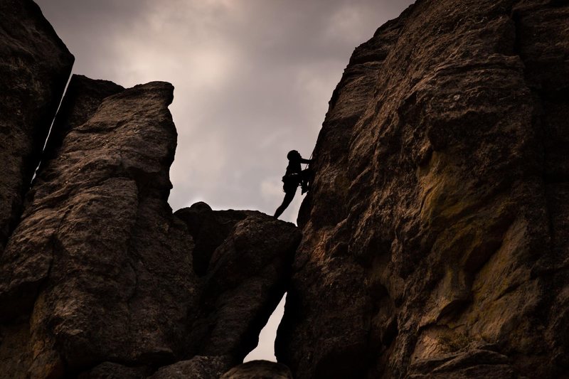 Anthony Petrone climbs the final face of Spire Two.<br>
<br>
Photo by Laura Heisinger.