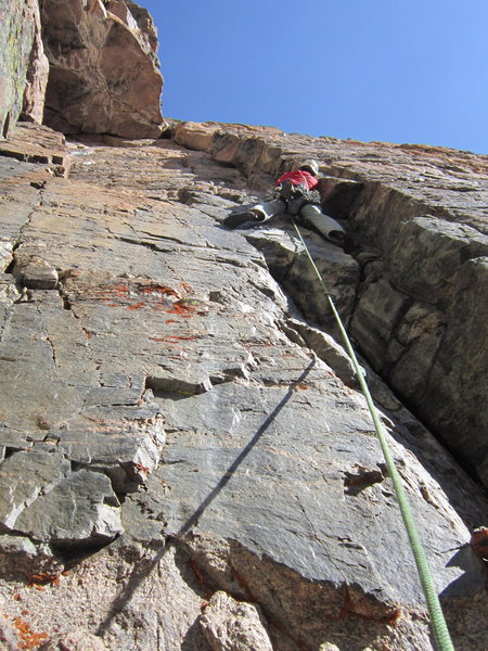 An unknown 5.10 variation on Flying Buttress. Brent Butler climbing. Mt. Meeker, RMNP, Colorado.