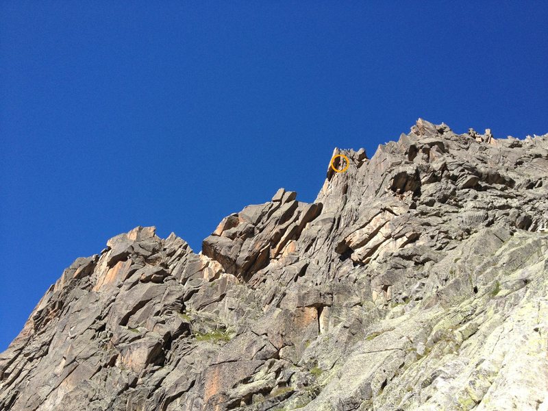 Climber (orange circle) on the crux of the route in 3rd tower, as seen from the descent.