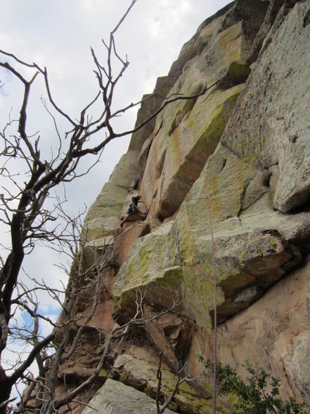 Climber on the first pitch of Cream of Belay, a terrific arching crack/roof system
