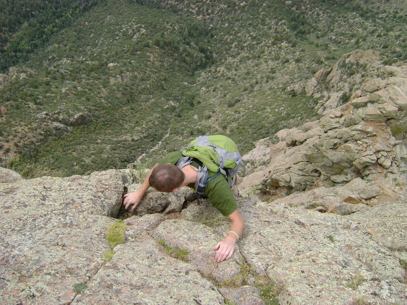 Randy climbing the 5th class.