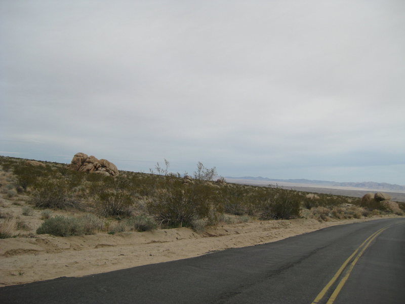 Curelom Rock (big one) as seen leaving from Indian Cove Camp Ground. Scout rock is also visible close to the road on the right. Cumom rock is in between Scout and Curelom covered up by the Creosote bush.