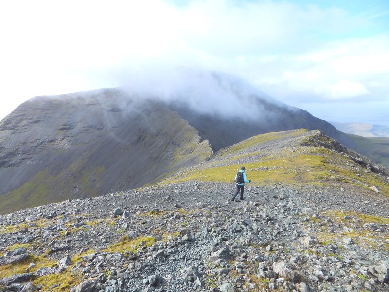 Lyn heading towards the summit of Ben More on the Isle of Mull. This was Pete and Lyn Armstrong's final ascent of all the Munro's .The 282 mountains in Scotland over 3000'.A long hard journey that often takes climbers a life time to compleat. The terrain of these mountains is very simular to the last 3000' of the fifty five 14,000' mountains in the Colorado Rockies.Photo Pete Armstrong