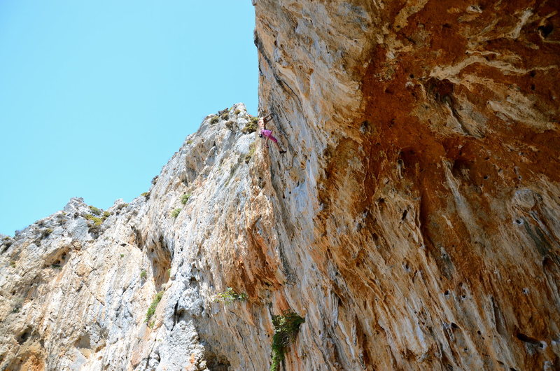 Nearing the sharp, crimpy top crux of Raptor