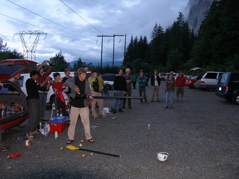Parking lot games: shooting the lucky climber with a potato gun.