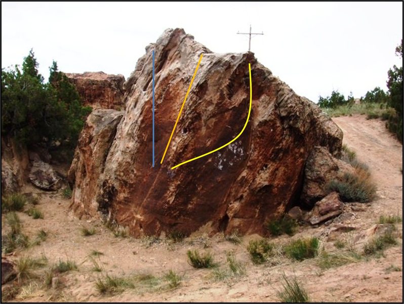 Desert Storm Boulder. I Spade My Cat (V1+) in blue, Wise Water (V2) in orange, and Overland Flow (V0+) in yellow.
