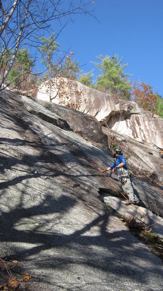 Craig Taylor checking out the crux of pitch one. Manifest Destiny