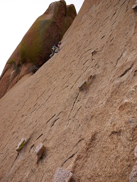 Jay on the 3rd pitch traverse. Highly recommend going straight up past bolt #2 to finish rather than going up that chimney!
