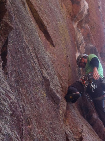 Resting before just before the crux on his red point ascent.