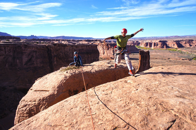 Jumping over the chimney to the other half of the summit which is slightly higher.