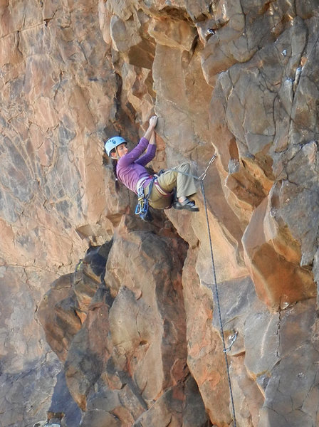 Amy swinging out onto the arete on "Holding Pattern"