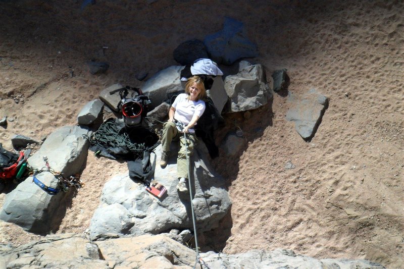 Brenda belays from the ideal reclining rock.