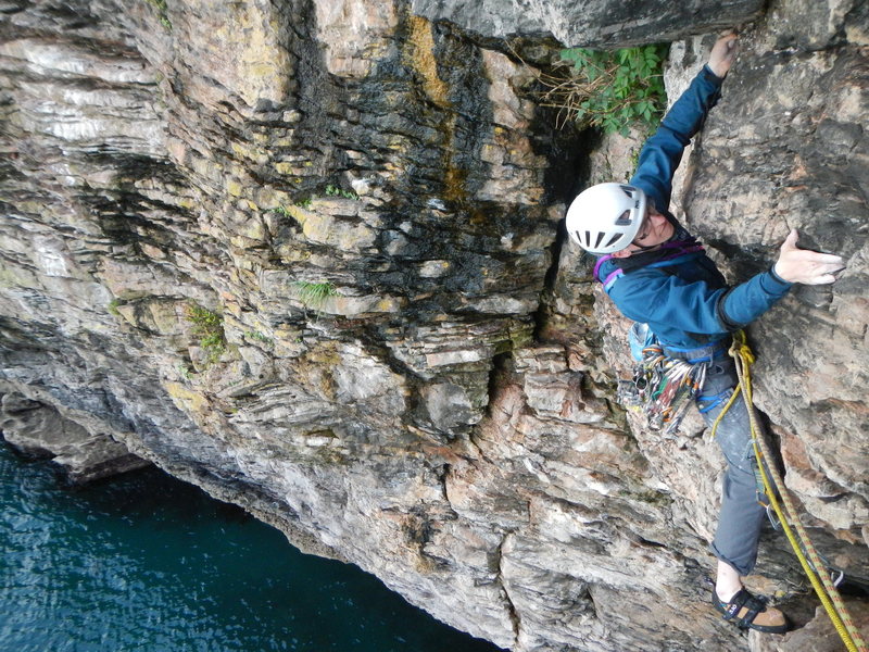 tom on the crux move towards the end of pitch 1