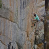Climber on the first technical, crimpy crux, most likely crimping more than required. Photo: John Hinrichsen.<br>
