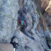 Looking down from a belay above the first crux.  Optionally, you can belay where scott's standing, as per the guidebooks.