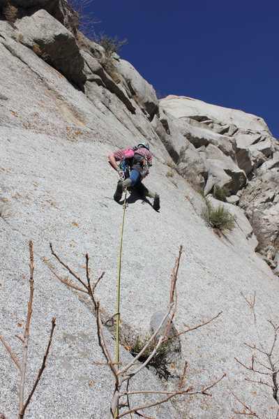 Starting the 5.10+ friction traverse on the first pitch