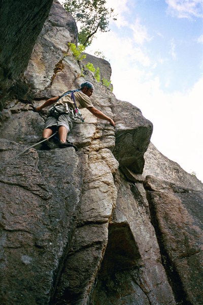Luan Kruger of S Africa contempeting the 5.9 + crux on Diedra, Cathedral Ledges, NH