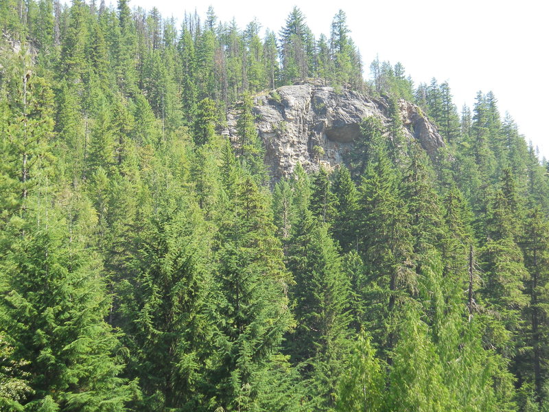 BEGBIE BLUFFS (Raptor)as first seen when hiking down the trail. The main trail contours below the crag to an overlook above the Columbia River/Upper Arrow Lake.