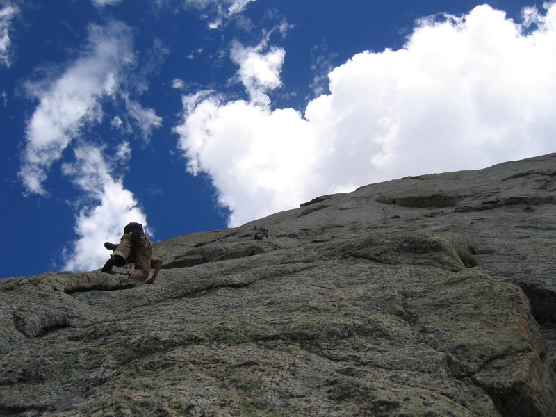 Seconding the third pitch. The crux 5.10 dihedral can be seen in the right upper section of the  photo