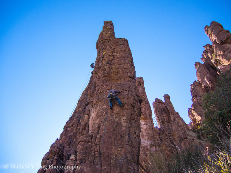 Approaching the second bolt that is on the slant side of a great rest ledge.