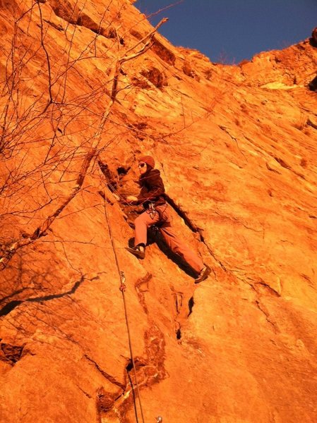 Sarah climbing Catwoman's Claw at sunset