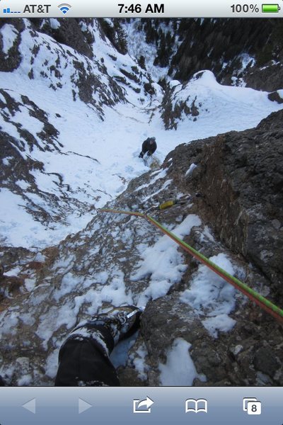 Eric Wellborn's boot and Noah McKelvin belaying pitch 5.