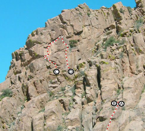 Looking to the North from the West End (Fin/Elverum Cove) of Southern Comfort Wall. <br>
<br>
Only top of C & D are visible. They are in a slot on the top of the ridge. <br>
<br>
A. Done For Already<br>
B. Karma<br>
C. The Goat Path<br>
D. Three Pump Chump