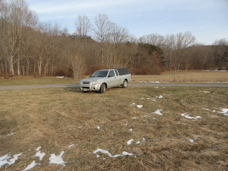 Parking area. The trail head to downstream areas begins to left of truck in corner of campground. Trail head to Upstream areas to right of truck in corner of field.