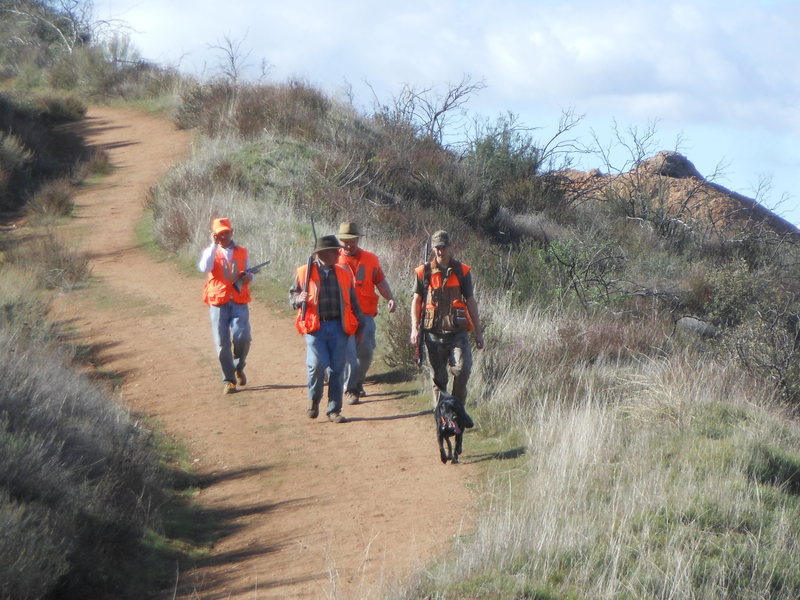 Hunters returning from shooting quail in the hills surrounding Texas Canyon.