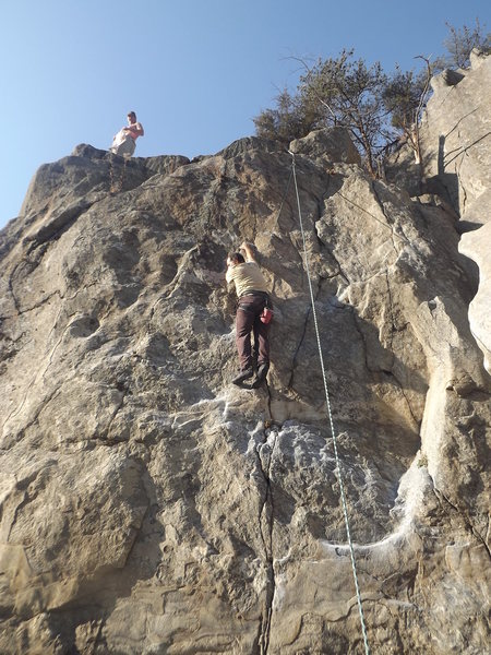 Dave Rockwell on Soapstone. Tombstone follows the crack and sickle corner to his right. Winter's Tale goes straight up the face to his left directly underneath the sunbather.