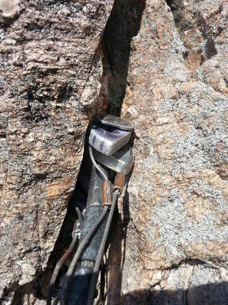 This is the bomber (and crucial) cam at the start of the corner. The placement was significantly improved with a nut tool (on a subsequent ascent) from the originally poor placement used on the FA, making the move much safer.