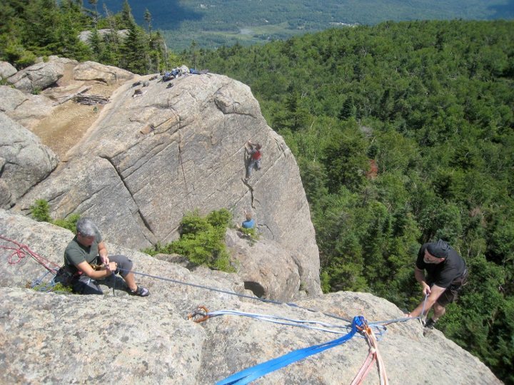 Jeff and Laurel in the foreground on <em>Rock of Ages</em>; Jay climbs <em>Toiling Men</em> in the background.