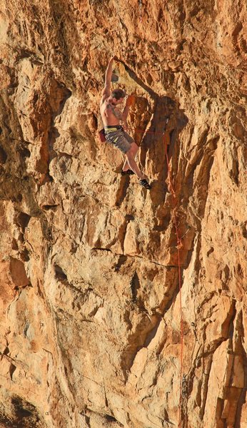 Lance working the route <br>
before the FA<br>
New Beginning (5.12+)