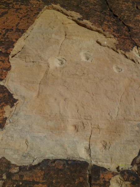 Bullet scars above the first belay ledge on Book of Prophecy.