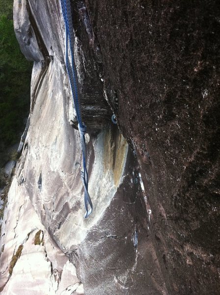 Photo showing steepness at start of P2 boulder problem. This section of the crux v7 boulder problem is a deadpoint to get established in some overhanging tips liebacking that leads to the crux long reach at the top of the shallow corner.